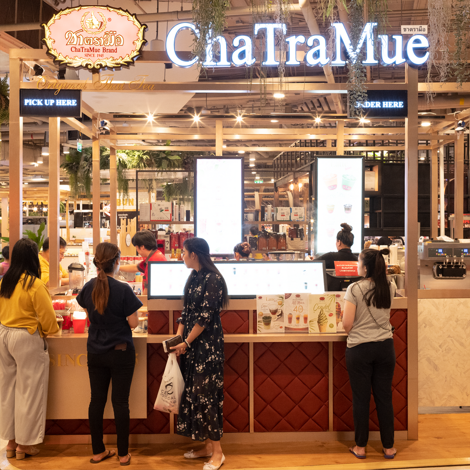ChaTraMue tea shop in Thailand with customers waiting for their drinks.